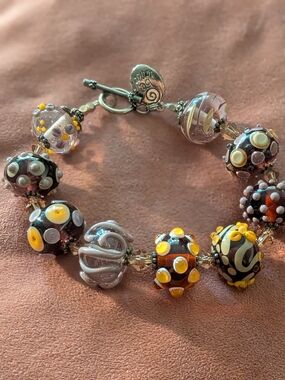 handcrafted Chunky lampwork glass beads in amber, black, and silver tone